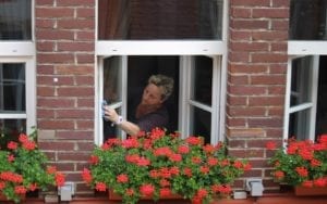 Woman cleaning window