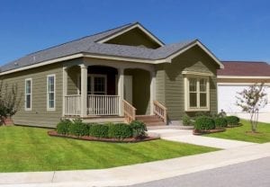 Olive colored house with grey roof